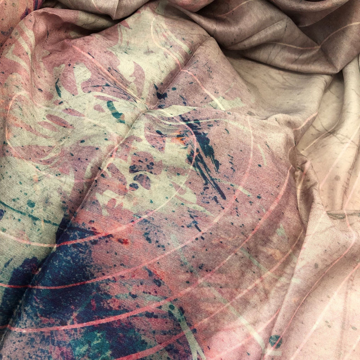 Glorious Mess silk cotton sarong showing the range of  soft colours throught to make it a must have resort accessory.